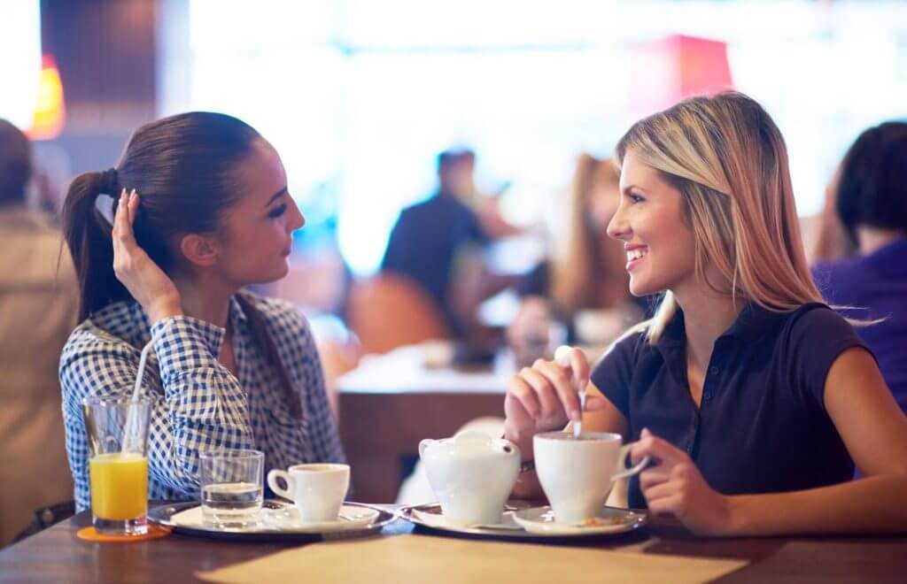 women-talking-having-coffee