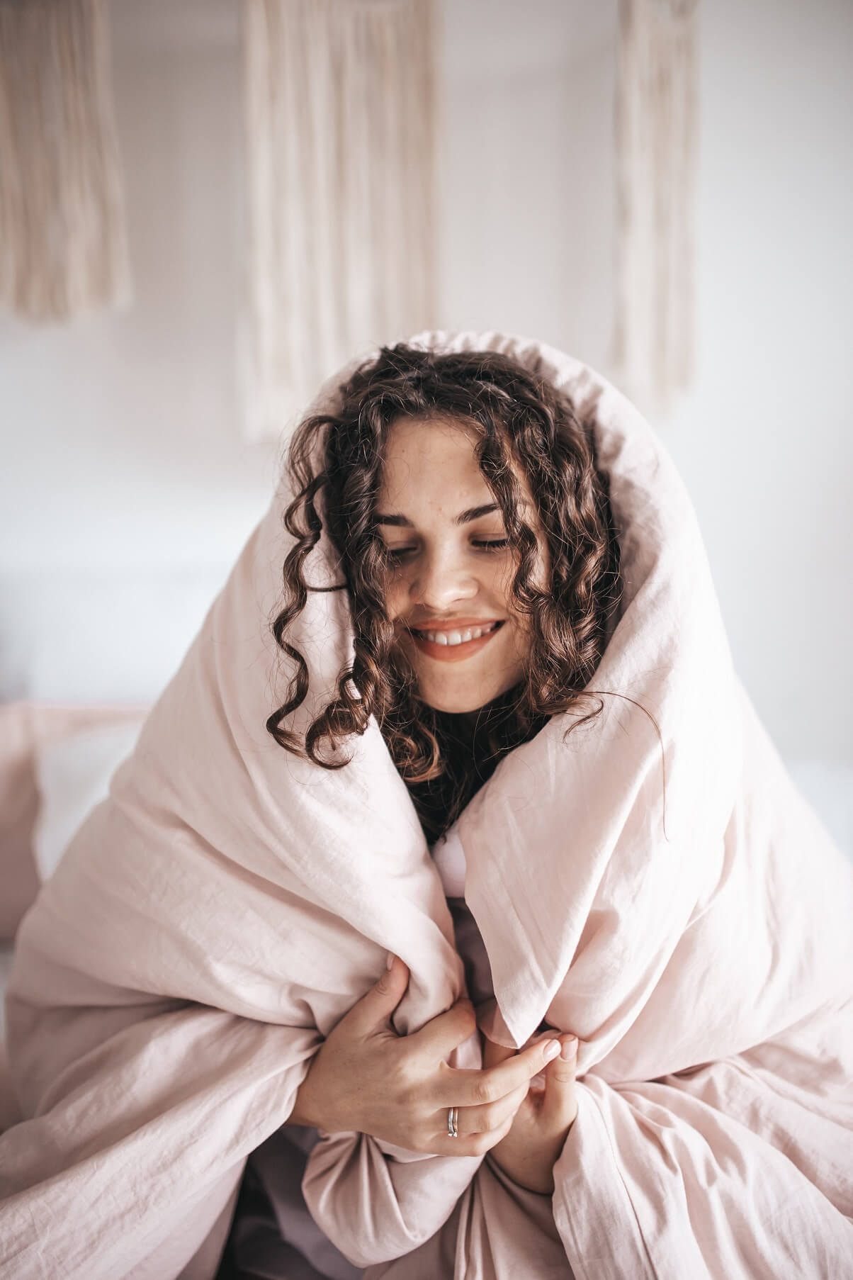 Woman wrapped in thick blanket