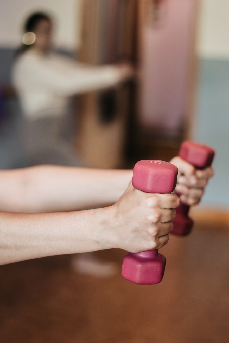 Woman holding hand weights