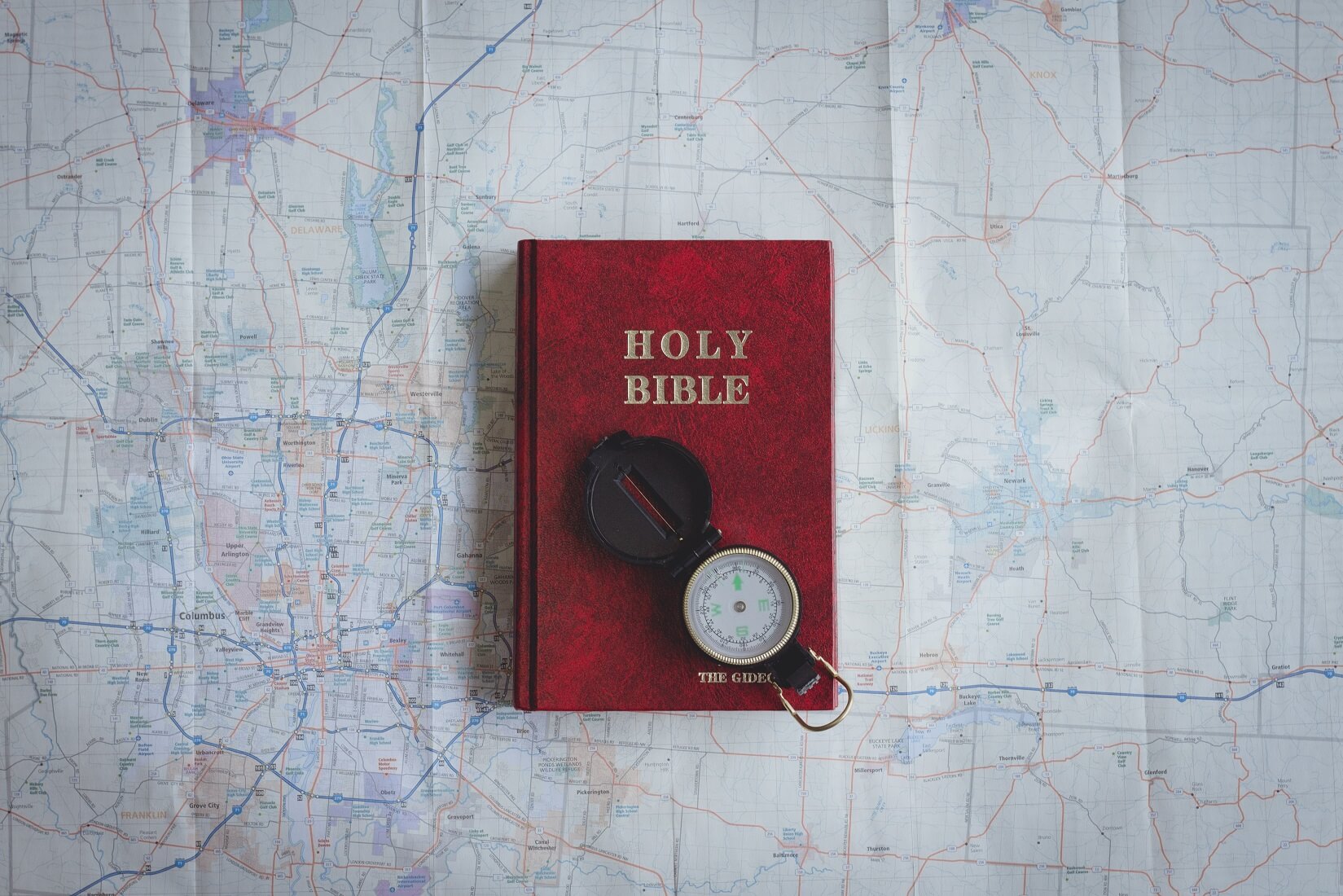 holy Bible on top of a map get guidance from God to Be Your Best Self