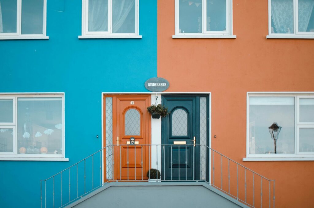 image of two doorways - one orange and one blue.